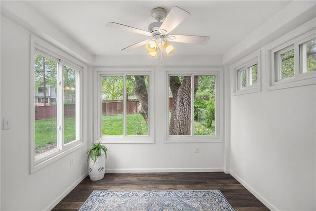 7620 Windsor St, Prairie Village, KS 66208 - unfurnished sunroom with baseboards and wood finished floors