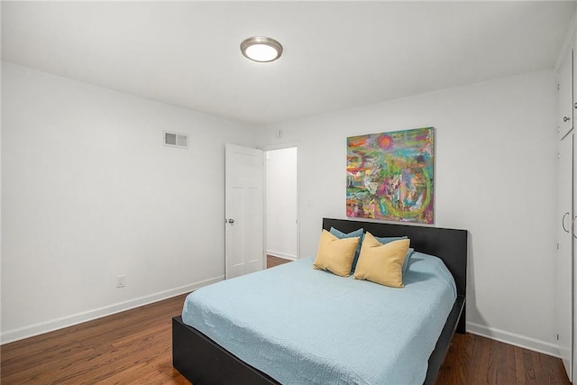 7620 Windsor St, Prairie Village, KS 66208 - bedroom with baseboards, visible vents, and wood finished floors