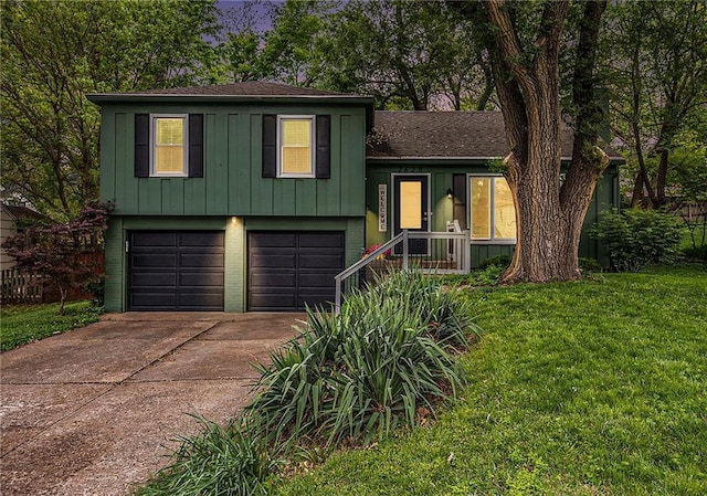 7620 Windsor St, Prairie Village, KS 66208 - split level home featuring a front yard, brick siding, a shingled roof, an attached garage, and driveway