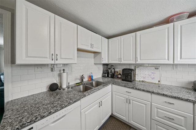 1340 E 85th St, Kansas City, MO 64131 - kitchen with white cabinets, dishwasher, decorative backsplash, stone countertops, and a textured ceiling