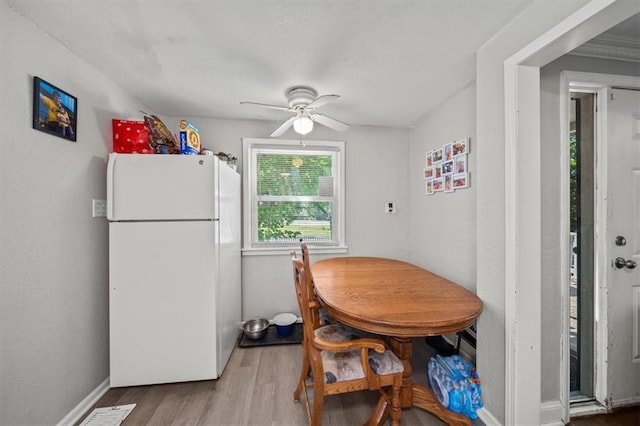 1340 E 85th St, Kansas City, MO 64131 - dining area with a ceiling fan and wood finished floors