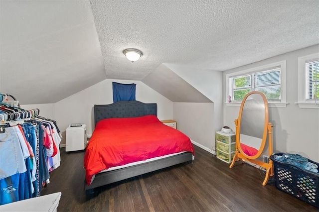 1340 E 85th St, Kansas City, MO 64131 - bedroom with wood finished floors, a textured ceiling, and vaulted ceiling