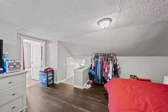 1340 E 85th St, Kansas City, MO 64131 - bedroom with wood finished floors, a textured ceiling, and lofted ceiling