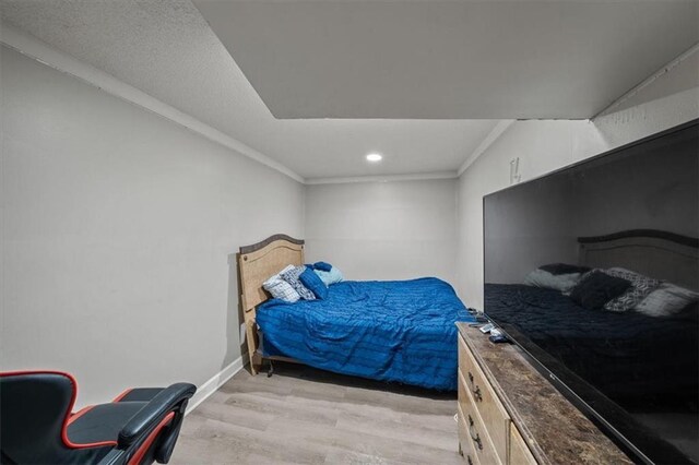 1340 E 85th St, Kansas City, MO 64131 - bedroom with light wood-type flooring, ornamental molding, and recessed lighting