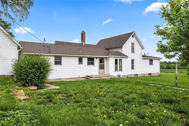 4933 SE Stubbs Rd, Tecumseh, KS 66542 - rear view of property featuring a chimney, a yard, and a shingled roof