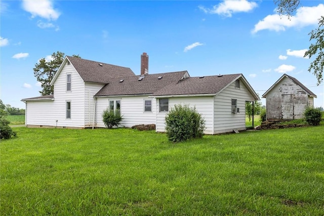 4933 SE Stubbs Rd, Tecumseh, KS 66542 - back of house featuring a chimney, a lawn, and a shingled roof