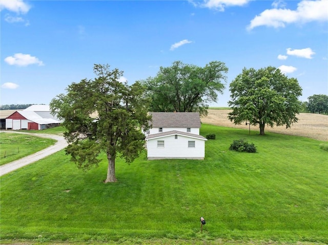 4933 SE Stubbs Rd, Tecumseh, KS 66542 - exterior space with dirt driveway, an outdoor structure, a detached garage, a view of rural / pastoral area, and a pole building