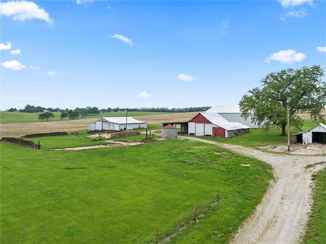 4933 SE Stubbs Rd, Tecumseh, KS 66542 - view of community featuring an outbuilding, dirt driveway, and a lawn