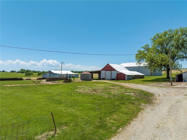 4933 SE Stubbs Rd, Tecumseh, KS 66542 - view of dirt / gravel driveway with a pole building
