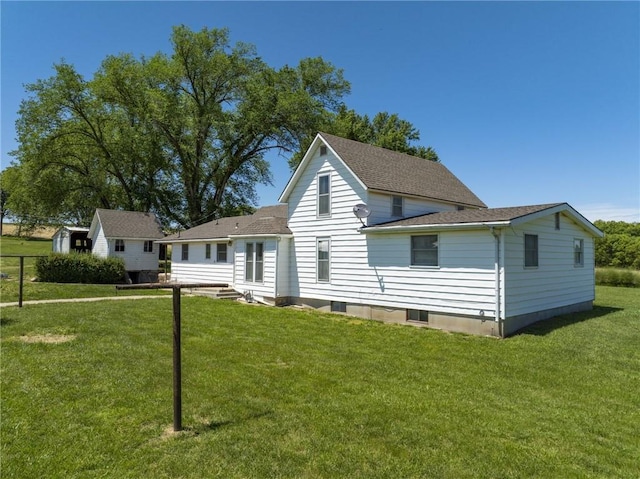 4933 SE Stubbs Rd, Tecumseh, KS 66542 - view of front of house featuring a front yard, a shed, and a shingled roof