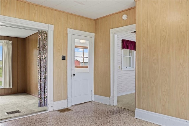 4933 SE Stubbs Rd, Tecumseh, KS 66542 - entryway with wood walls and baseboards