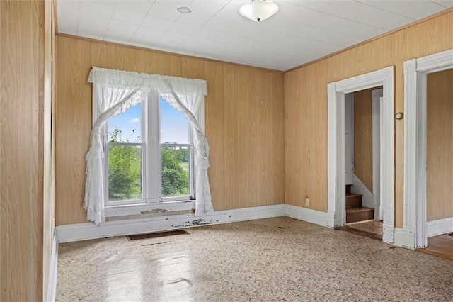 4933 SE Stubbs Rd, Tecumseh, KS 66542 - unfurnished room with wood walls and stairs