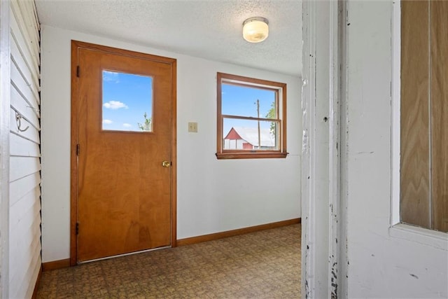 4933 SE Stubbs Rd, Tecumseh, KS 66542 - entrance foyer with a textured ceiling and tile patterned floors