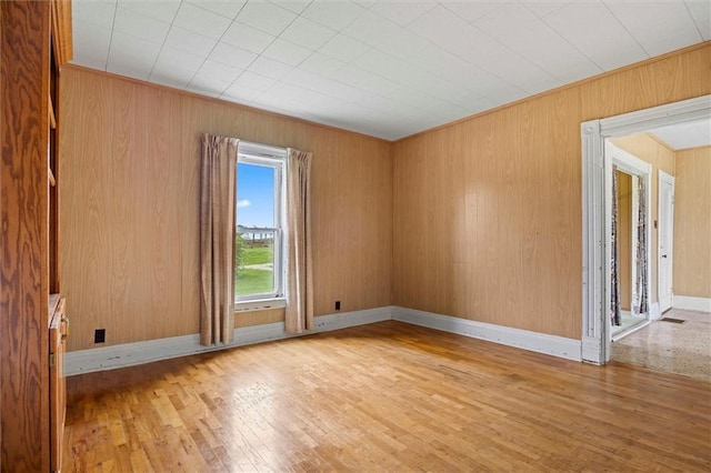 4933 SE Stubbs Rd, Tecumseh, KS 66542 - unfurnished room featuring hardwood / wood-style floors and wooden walls