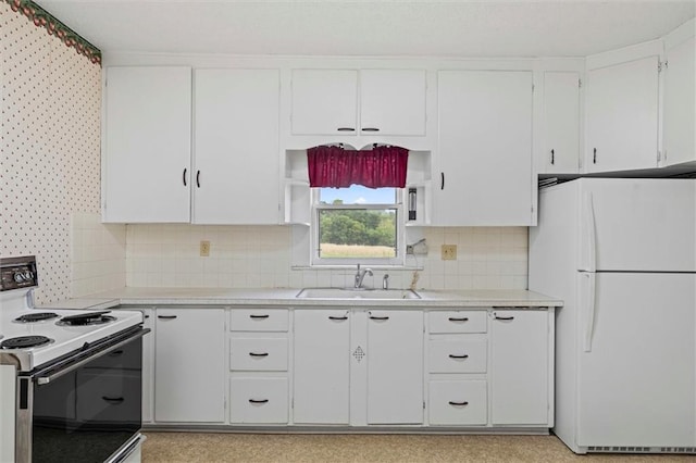 4933 SE Stubbs Rd, Tecumseh, KS 66542 - kitchen with white appliances, light countertops, and white cabinetry