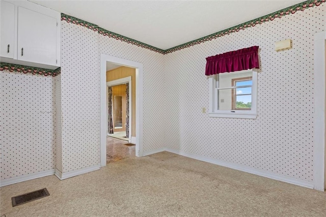4933 SE Stubbs Rd, Tecumseh, KS 66542 - spare room featuring carpet flooring and wallpapered walls