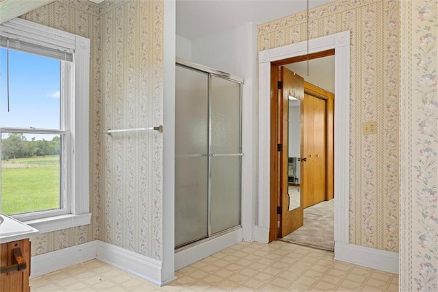 4933 SE Stubbs Rd, Tecumseh, KS 66542 - full bathroom featuring tile patterned floors, a stall shower, and vanity