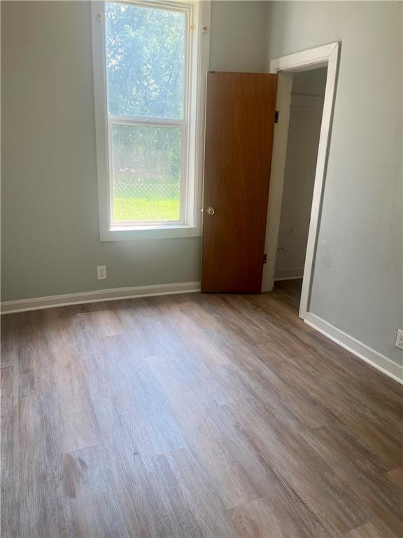 913 Vine St, Saint Joseph, MO 64503 - unfurnished room with wood finished floors and baseboards