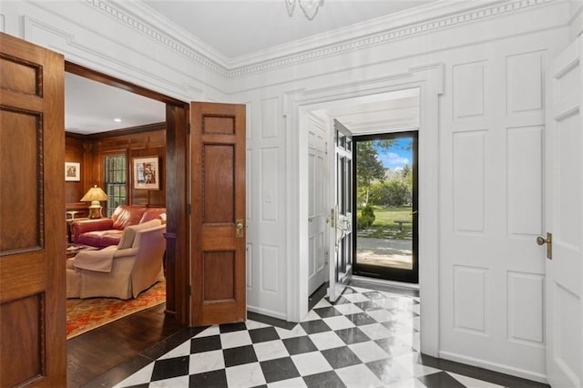 5801 Ward Pkwy, Kansas City, MO 64113 - foyer entrance with dark floors, wood walls, and crown molding