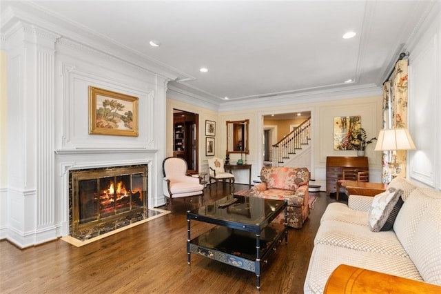 5801 Ward Pkwy, Kansas City, MO 64113 - living area with wood finished floors, stairs, a high end fireplace, and a decorative wall