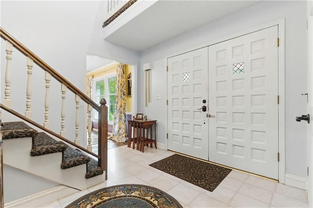 16524 Horton St, Stilwell, KS 66085 - tiled foyer entrance with stairway and baseboards