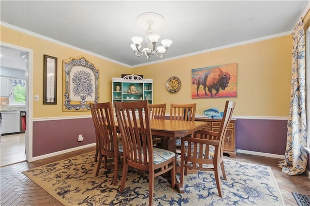 16524 Horton St, Stilwell, KS 66085 - dining room featuring a chandelier, ornamental molding, and baseboards