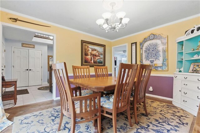 16524 Horton St, Stilwell, KS 66085 - dining space with a chandelier, ornamental molding, and baseboards