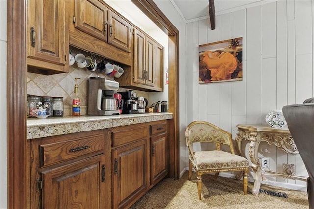 16524 Horton St, Stilwell, KS 66085 - kitchen with tasteful backsplash, light countertops, brown cabinets, and carpet floors
