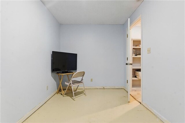 16524 Horton St, Stilwell, KS 66085 - bedroom featuring finished concrete floors and baseboards