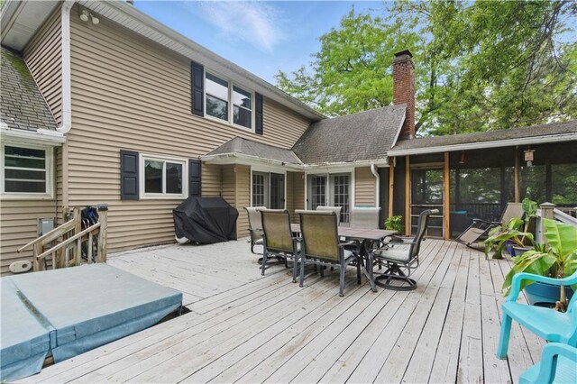 16524 Horton St, Stilwell, KS 66085 - wooden deck featuring a grill and outdoor dining space