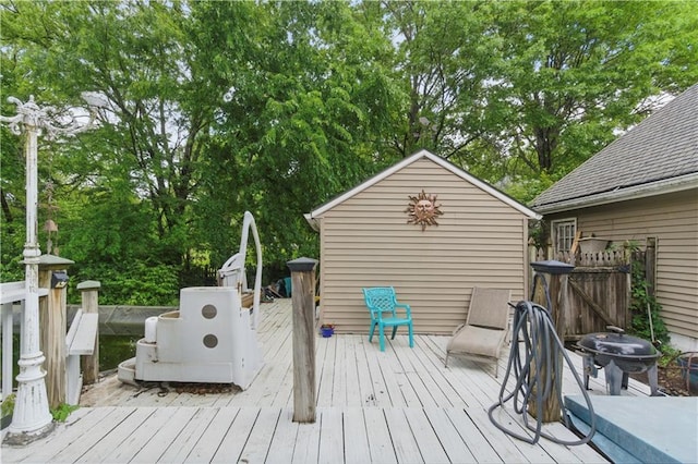 16524 Horton St, Stilwell, KS 66085 - wooden deck with grilling area and view of wooded area