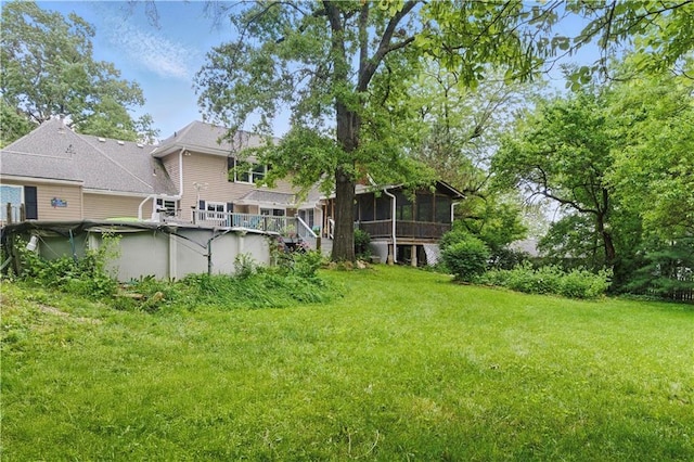 16524 Horton St, Stilwell, KS 66085 - view of green lawn featuring a sunroom and a covered pool