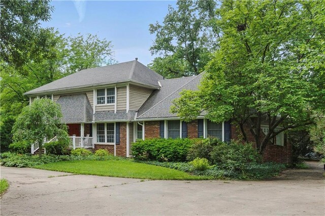 16524 Horton St, Stilwell, KS 66085 - traditional-style house featuring brick siding