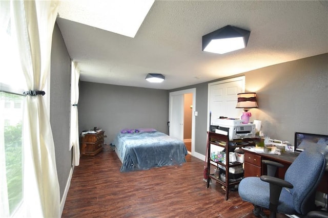 4015 Benton Blvd, Kansas City, MO 64130 - bedroom featuring wood finished floors, a desk, and a textured ceiling