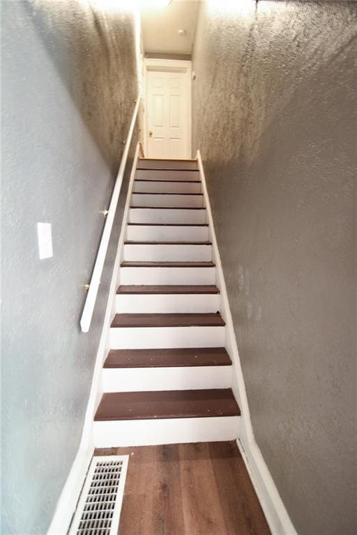 4015 Benton Blvd, Kansas City, MO 64130 - stairway featuring wood finished floors