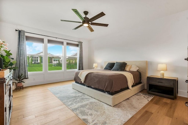 bedroom with a ceiling fan and wood finished floors