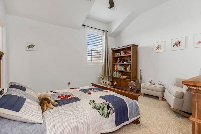 bedroom featuring visible vents, carpet flooring, and vaulted ceiling