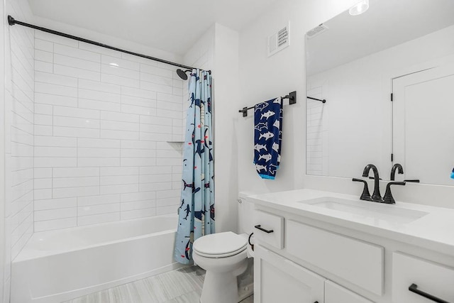 full bathroom with visible vents, shower / tub combo, toilet, and vanity