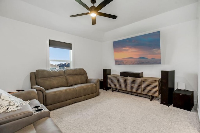 carpeted living room featuring a ceiling fan