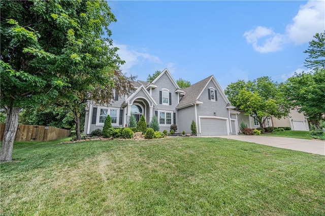 7325 Oakview St, Shawnee, KS 66216 - traditional-style house with concrete driveway, stucco siding, and an attached garage