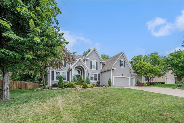 7325 Oakview St, Shawnee, KS 66216 - traditional home featuring concrete driveway and stucco siding
