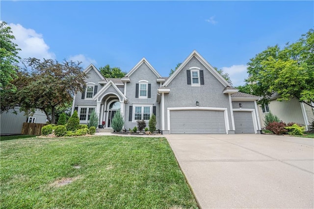 7325 Oakview St, Shawnee, KS 66216 - traditional-style home with driveway, stucco siding, and a garage