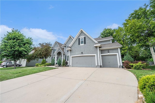7325 Oakview St, Shawnee, KS 66216 - traditional-style home with concrete driveway, a front yard, and stucco siding