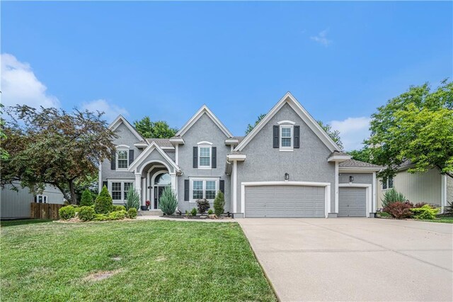 7325 Oakview St, Shawnee, KS 66216 - traditional-style house featuring driveway and a garage