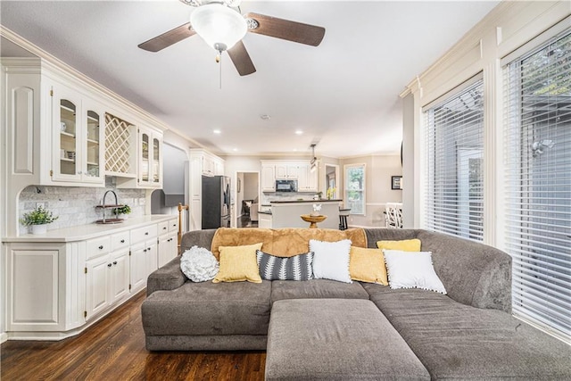 7325 Oakview St, Shawnee, KS 66216 - living room with dark wood-style flooring, ceiling fan, recessed lighting, and ornamental molding