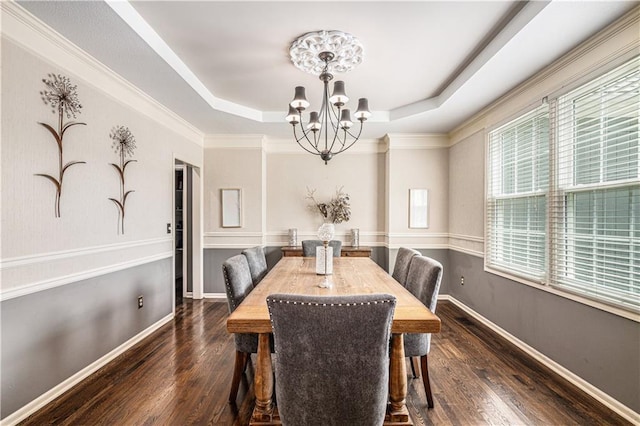 7325 Oakview St, Shawnee, KS 66216 - dining room featuring a chandelier, plenty of natural light, a tray ceiling, and wood finished floors
