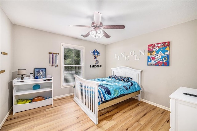 7325 Oakview St, Shawnee, KS 66216 - bedroom featuring light wood-style floors and ceiling fan