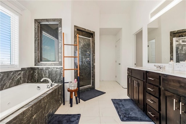 full bathroom with a bath, vanity, marble finish floor, and a stall shower