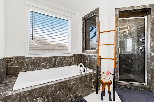 bathroom with a whirlpool tub and a shower stall