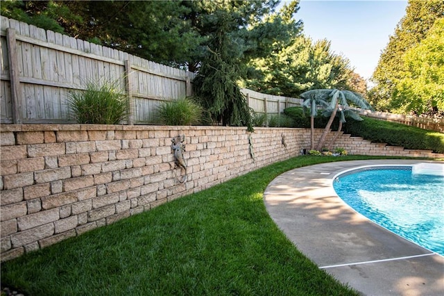 view of pool featuring a fenced backyard